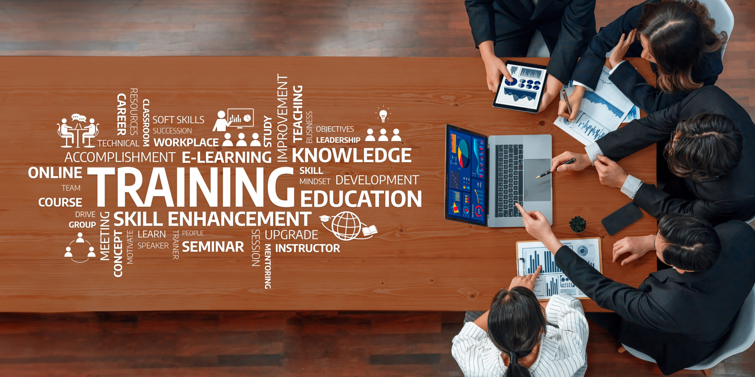 A diverse team collaborates during a professional meeting emphasizing training and skill enhancement,